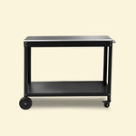 Desserte Oliva noire pour plancha Vivaplancha, plateau en inox et étagère basse ouverte, sur fond beige. ::visuel:sanscache